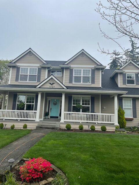 Craftsman home with new gutter installation on an overcast Pacific Northwest day